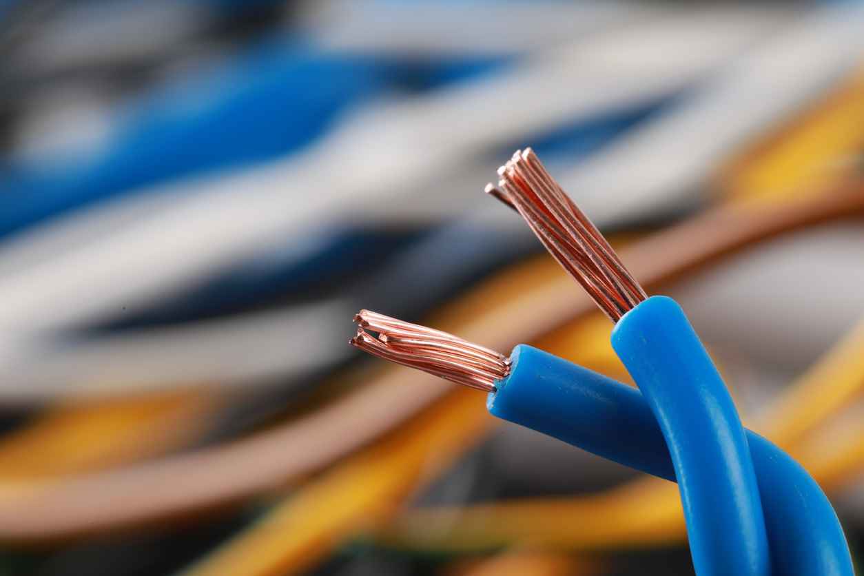 Close-up of electrical wiring for whole home rewiring. Copper wires with blue insulation. Electrical service upgrade in Oviedo, FL.