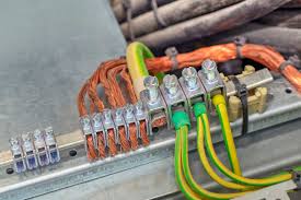 Electrical wiring and connections. Home rewiring project showing copper wires and ground wires. Electrical panel in Oviedo, FL.