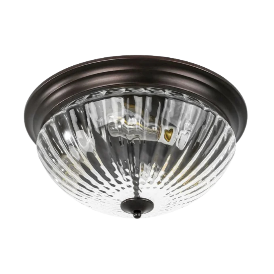 Ceiling-mounted flush mount light fixture with a textured glass shade and dark metal trim, ideal for providing ambient lighting in homes and businesses.