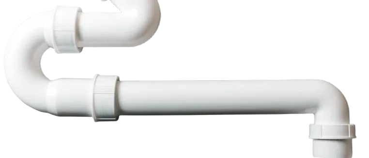 White PVC plumbing pipe showcasing a p-trap design, a crucial component used in residential and commercial plumbing systems in Oviedo, FL.
